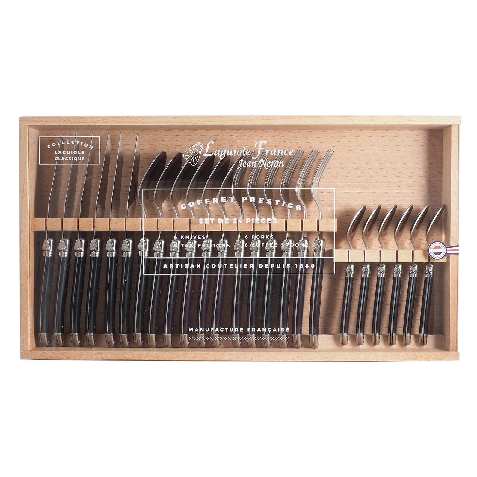 Complete 24-piece French flatware set arranged in branded presentation box, top view