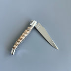 Half open knife from the other side with the blade pointing right