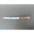 Laguiole forged bread knife with olive wood handle on a grey wood surface