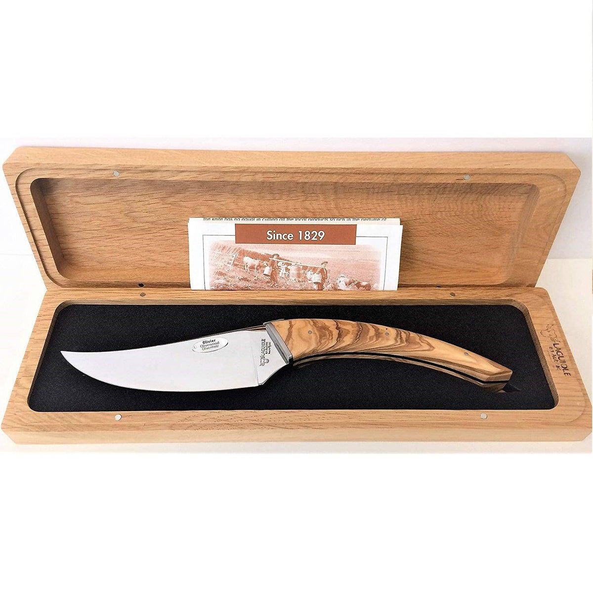 Laguiole olive wood cheese knife in its open oak box with a history card