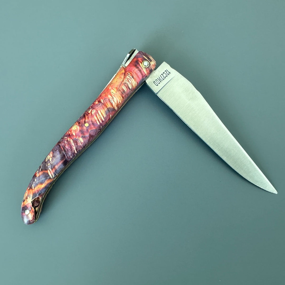 Knife half open with the blade pointing right