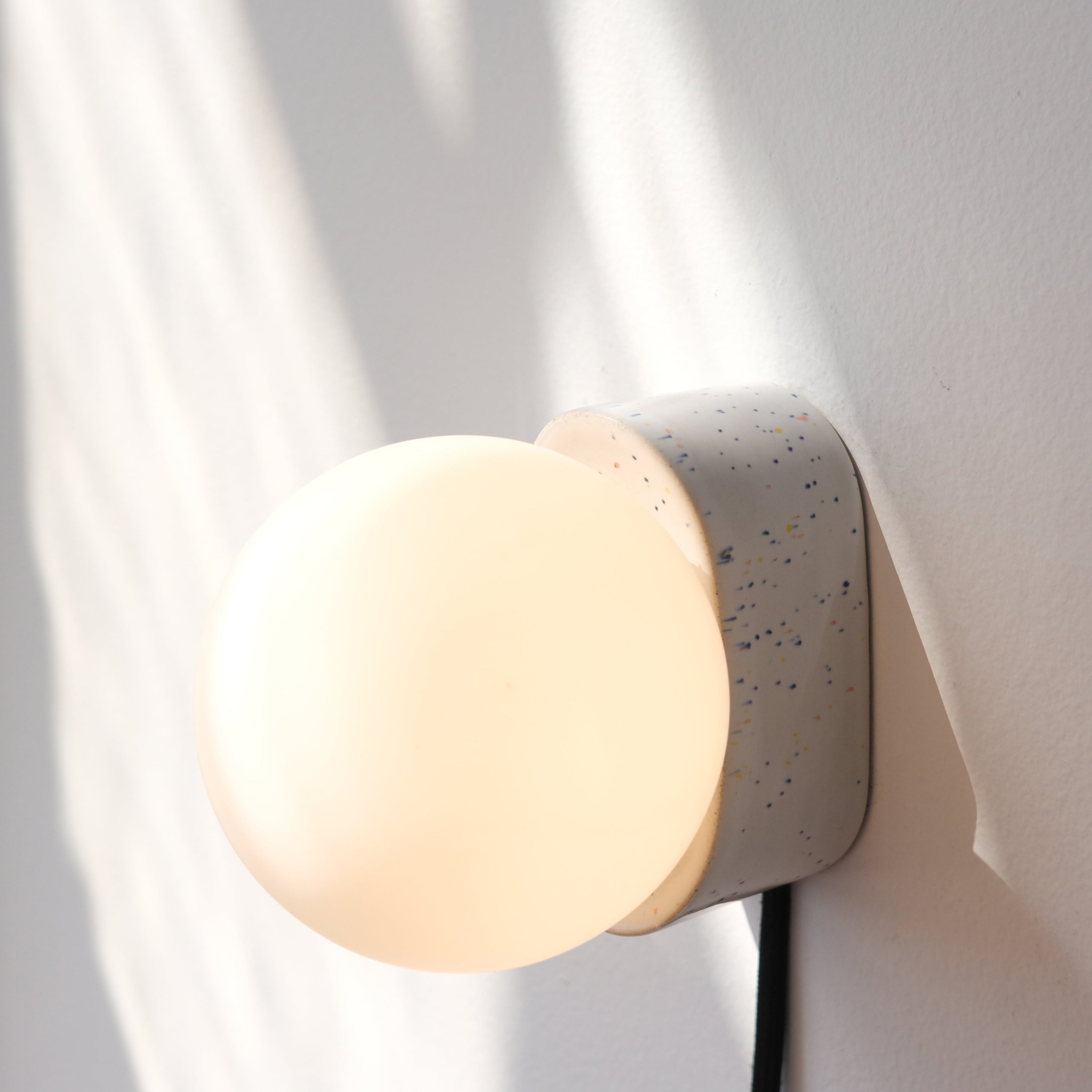 Iota Sconce in vermilion glaze detail