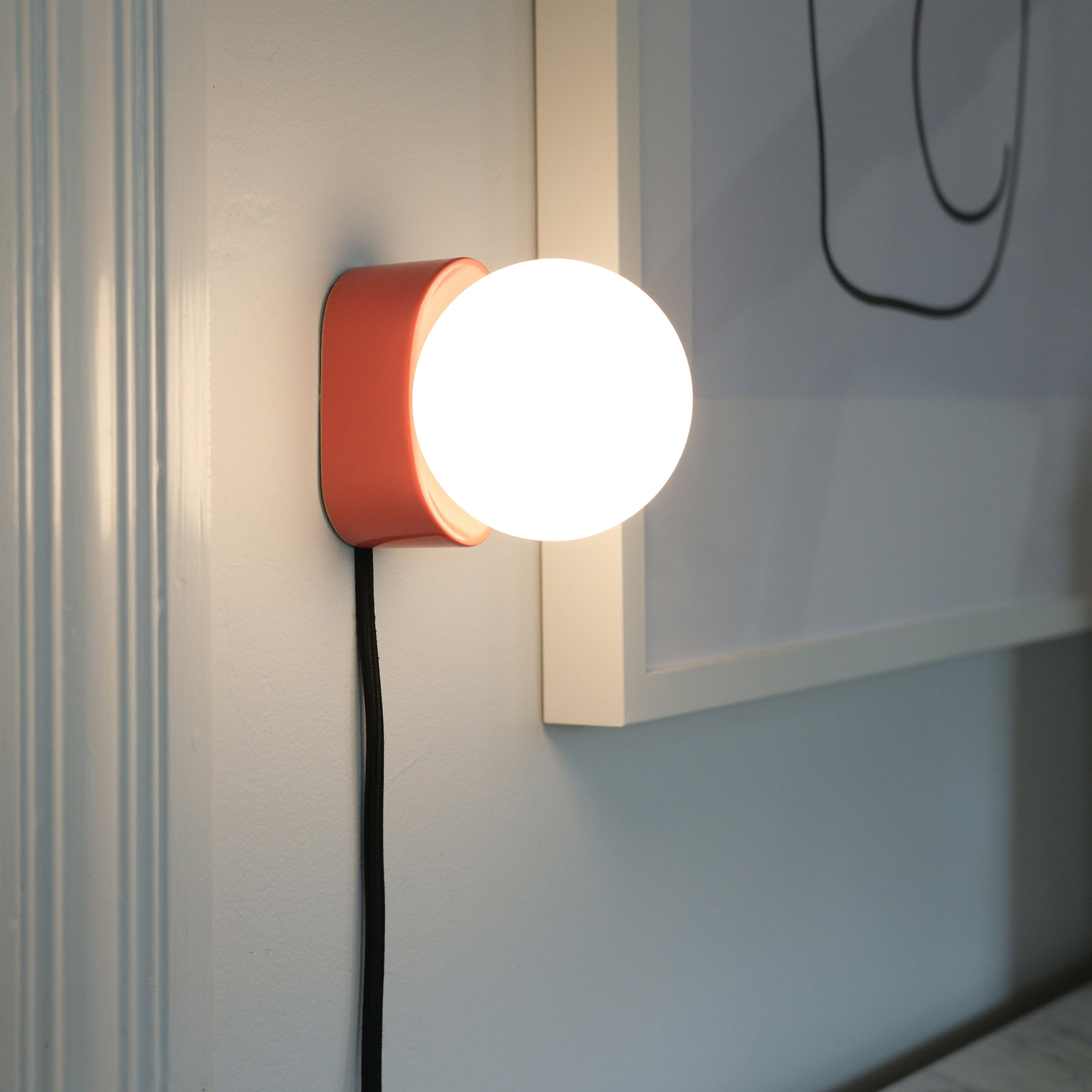 Iota Sconce pill-shaped ceramic body close-up