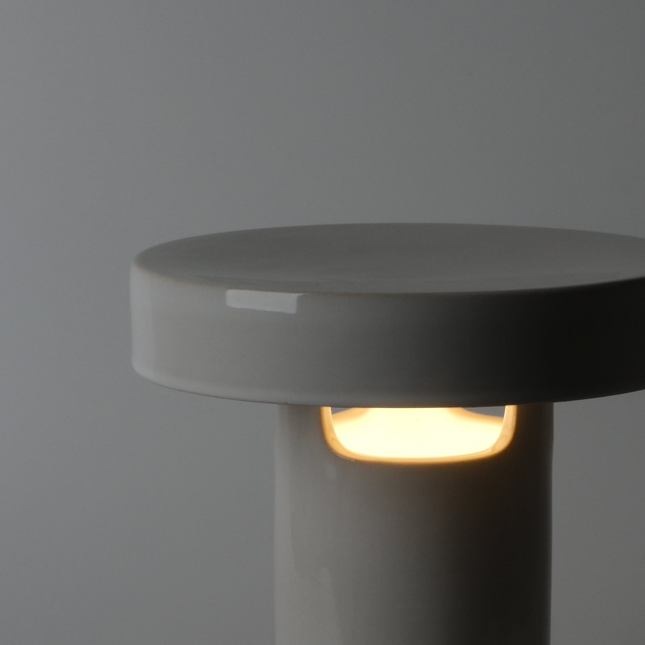 Slot Table Lamp lit, horizontal bands of light