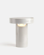slip cast ceramic lamp in White Glossy on a bookshelf